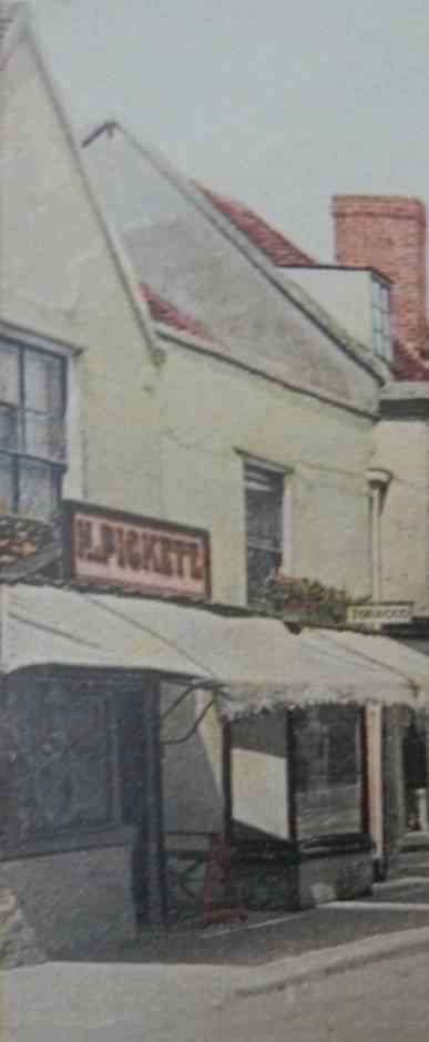Exterior of the building when it was a butchers, looking east.