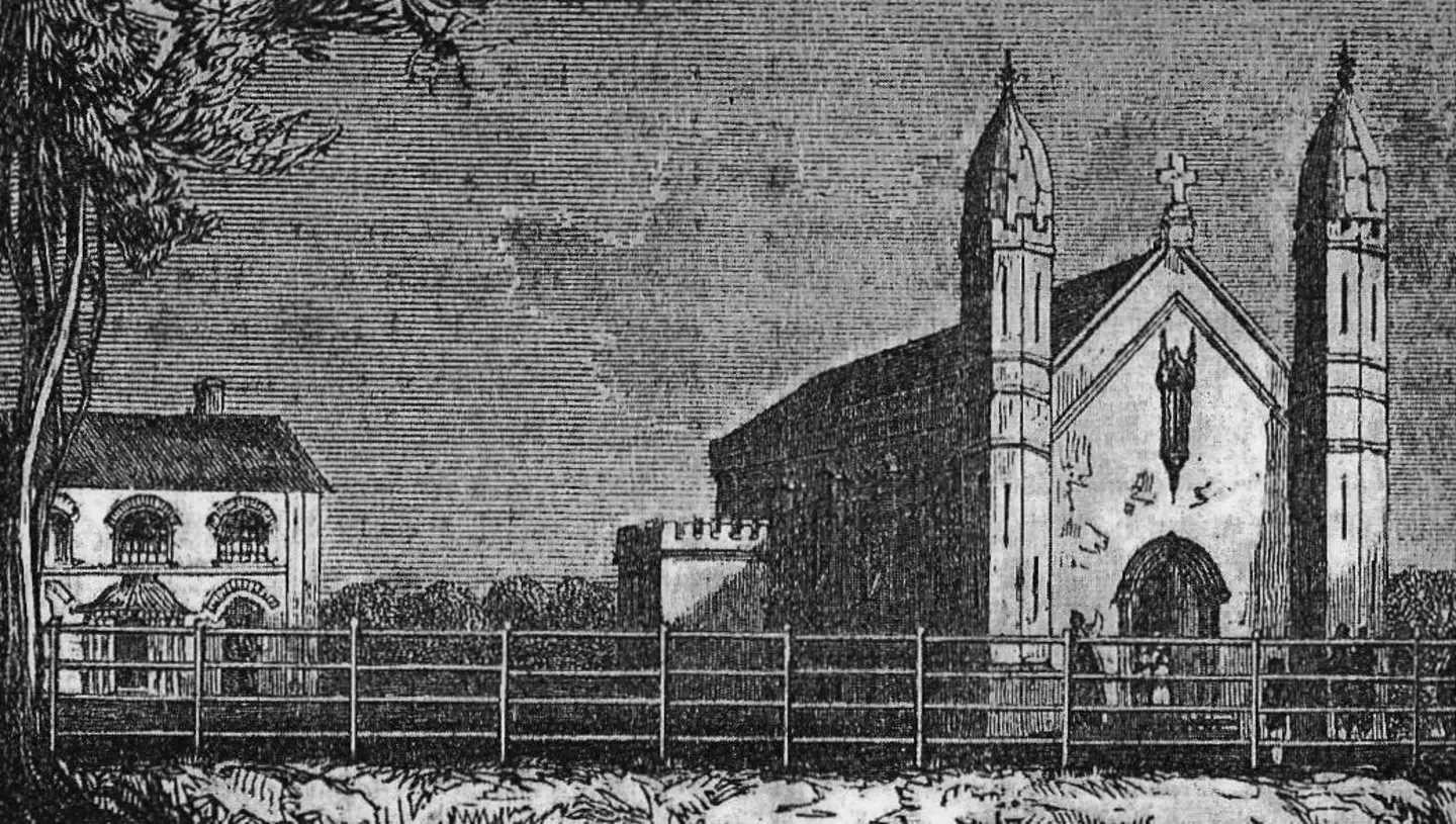 View of the church as originally built with the priest's house behind it.