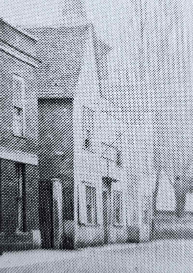 Looking west down the High Street towards the Chequers Inn in about 1870